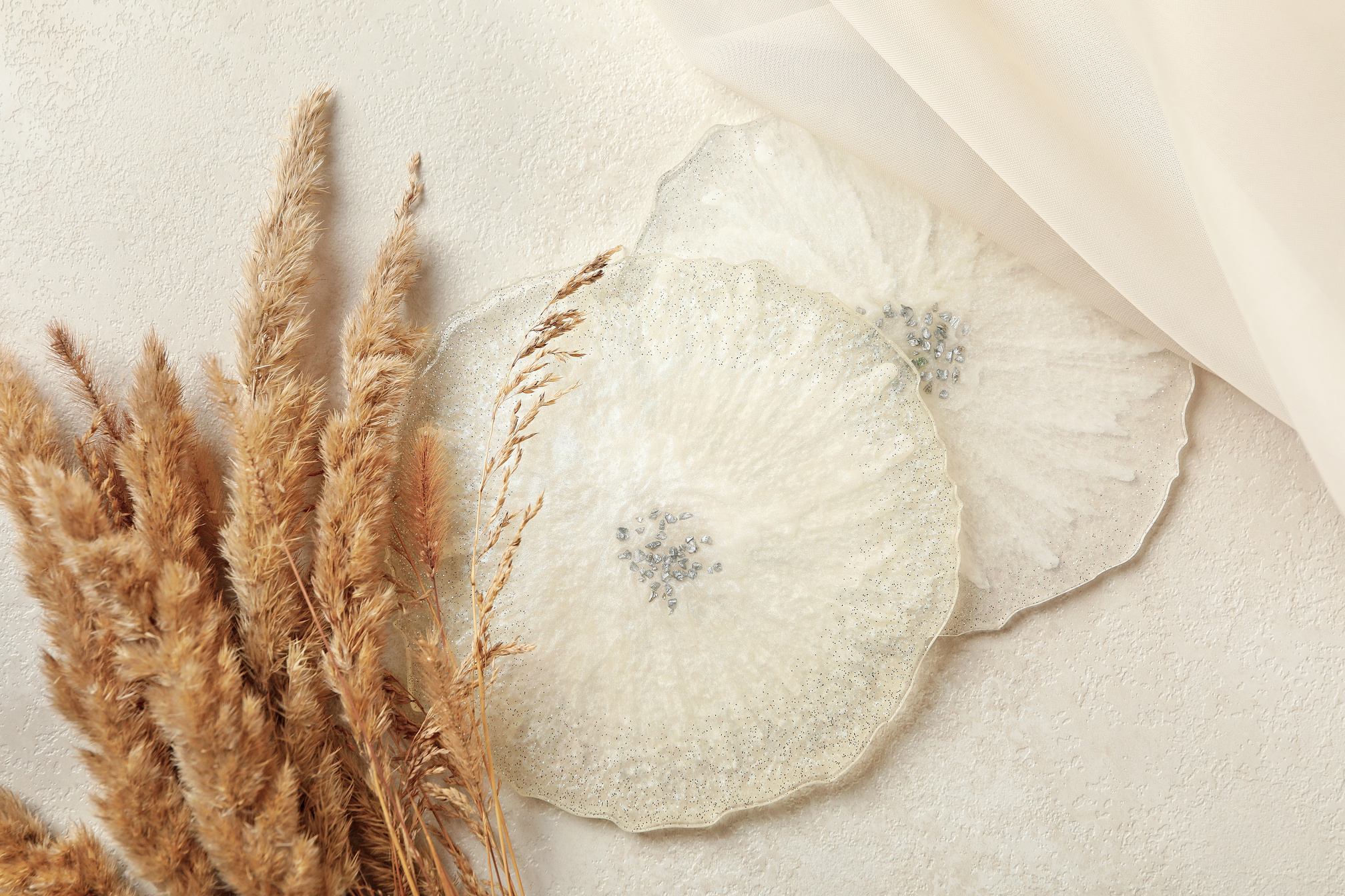 Epoxy Resin, Fabric and Field Flowers on White Background